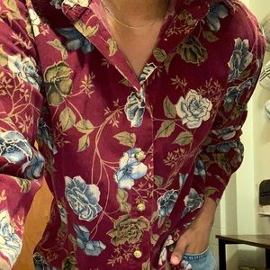 Blue flowered burgundy/reddish shirt.
